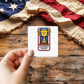 Achievement Unlocked Veteran sticker held over a vintage American flag on rustic wood, Veterans Day gift