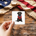 Battle Buddy Service Dog sticker held over a vintage American flag on rustic wood, Veterans Day gift