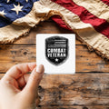 Combat Veteran sticker held over a vintage American flag on rustic wood, Veterans Day gift