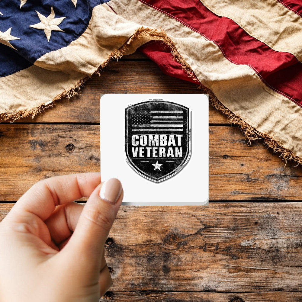 Combat Veteran sticker held over a vintage American flag on rustic wood, Veterans Day gift