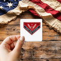 Count Your Blessings sticker held over a vintage American flag on rustic wood, patriotic Thanksgiving gift