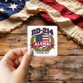 DD-214 Alumni sticker held over a vintage American flag on rustic wood, Veterans Day gift
