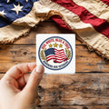 Honoring Our Veterans sticker held over a vintage American flag on rustic wood, Veterans Day gift