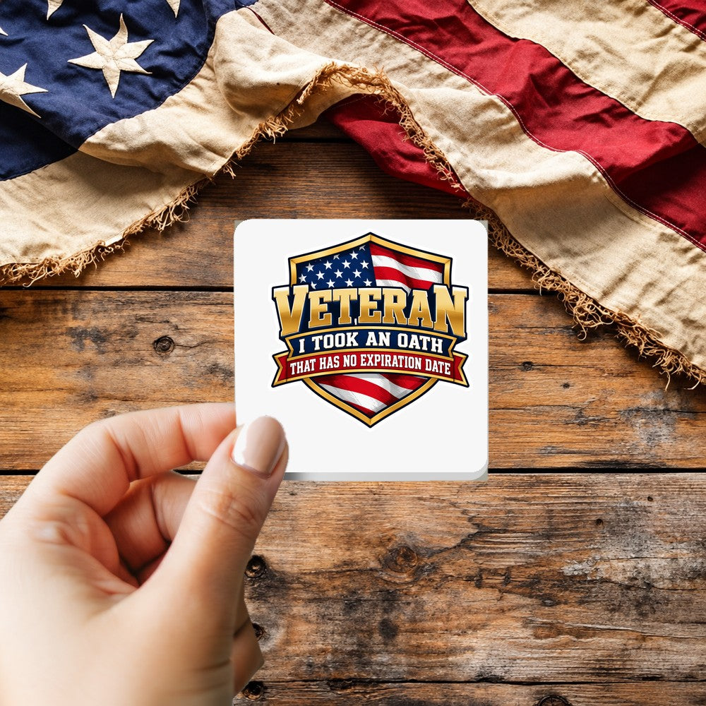 Veteran Oath No Expiration Date sticker held over a vintage American flag on rustic wood, Veterans Day gift
