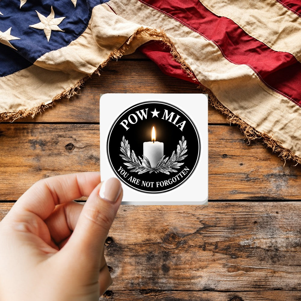POW MIA You Are Not Forgotten Patch Style sticker held over a vintage American flag on rustic wood, Veterans Day gift