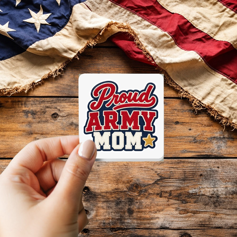 Proud Army Mom sticker held over a vintage American flag on rustic wood, Veterans Day gift