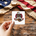 Proud to Have Served Tattoo Style sticker held over a vintage American flag on rustic wood, Veterans Day gift