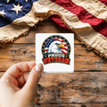 Proud Veteran Eagle sticker held over a vintage American flag on rustic wood, Veterans Day gift