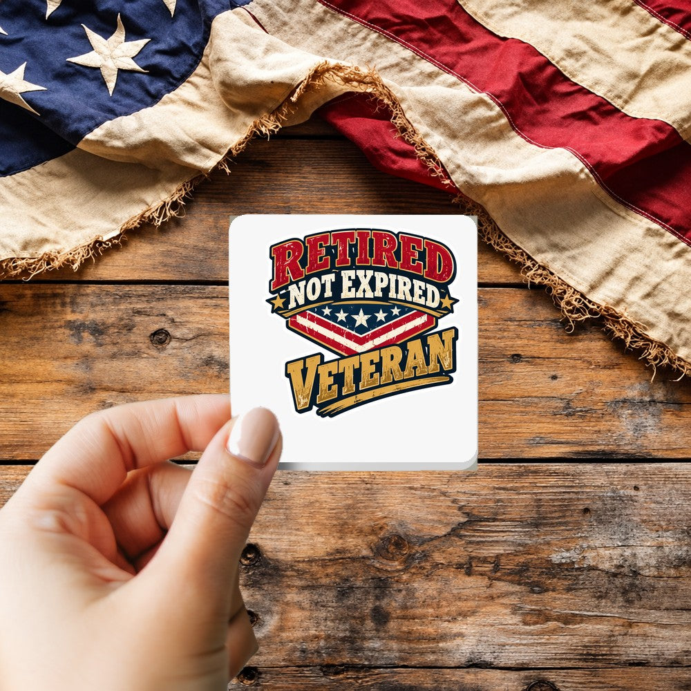 Retired Not Expired Veteran sticker held over a vintage American flag on rustic wood, Veterans Day gift