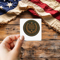 Service Sacrifice Freedom Patch Style sticker held over a vintage American flag on rustic wood, Veterans Day gift