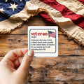 Veteran Definition sticker held over a vintage American flag on rustic wood, Veterans Day gift