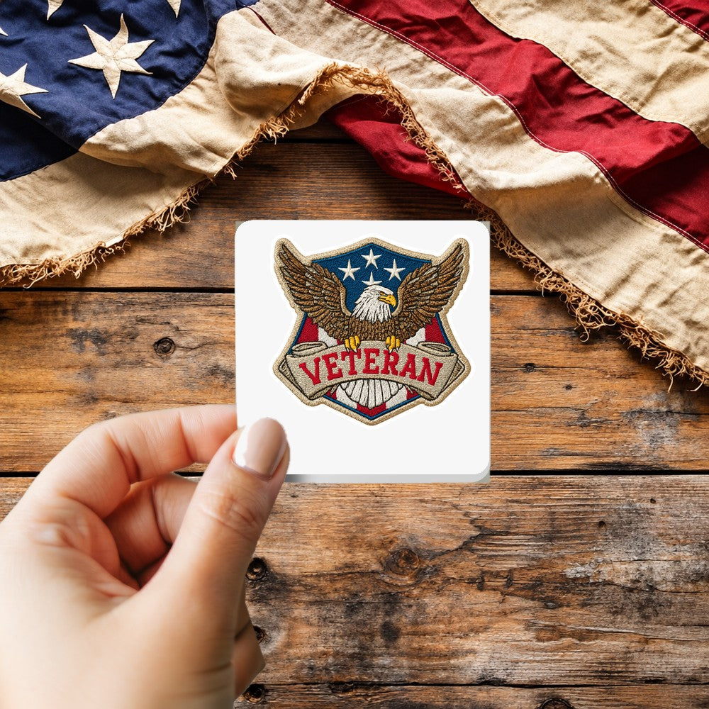 Veteran Eagle Patch Style sticker held over a vintage American flag on rustic wood, Veterans Day gift