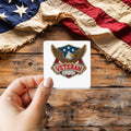 Veteran Eagle Patch Style sticker held over a vintage American flag on rustic wood, Veterans Day gift
