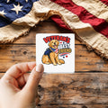Veteran's Best Friend sticker held over a vintage American flag on rustic wood, Veterans Day gift