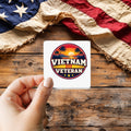Vietnam Veteran sticker held over a vintage American flag on rustic wood, Veterans Day gift