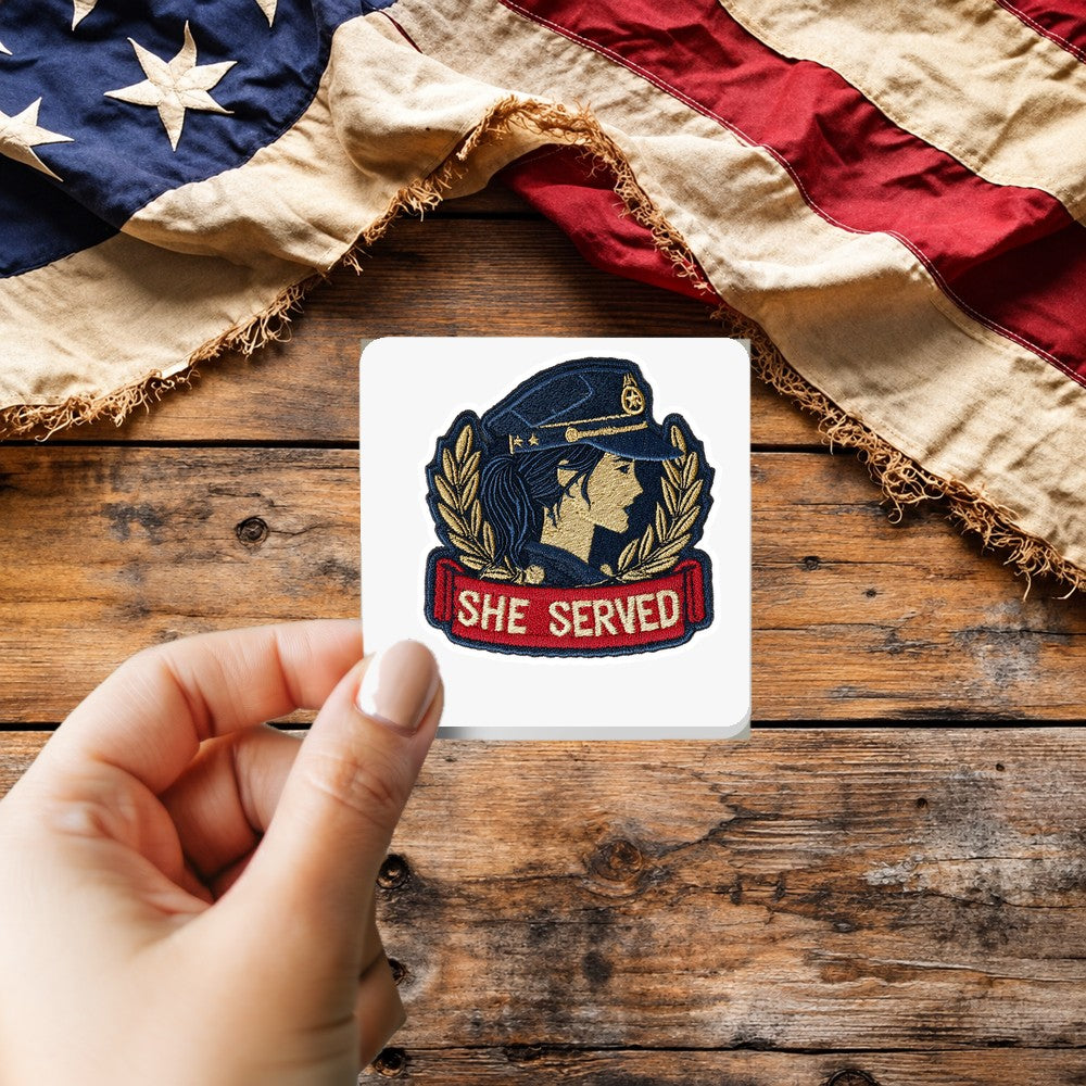 Woman Veteran She Served sticker held over a vintage American flag on rustic wood, Veterans Day gift