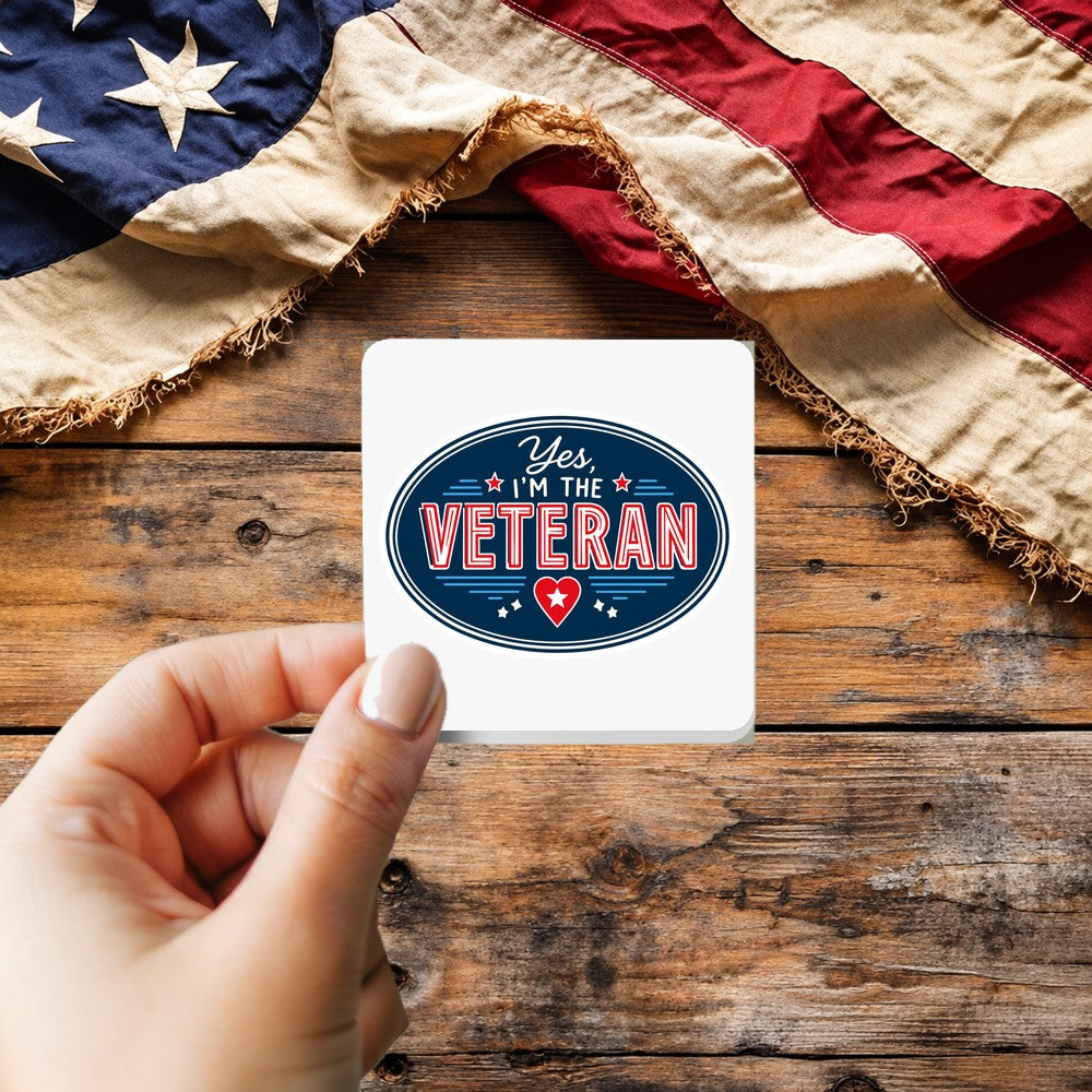 Yes I'm The Veteran Patch Style sticker held over a vintage American flag on rustic wood, Veterans Day gift